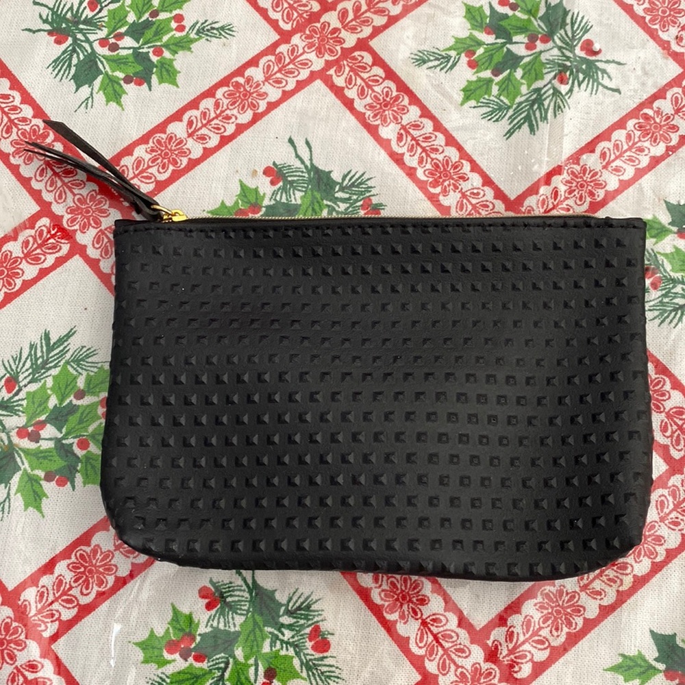 Small textured cosmetics bag